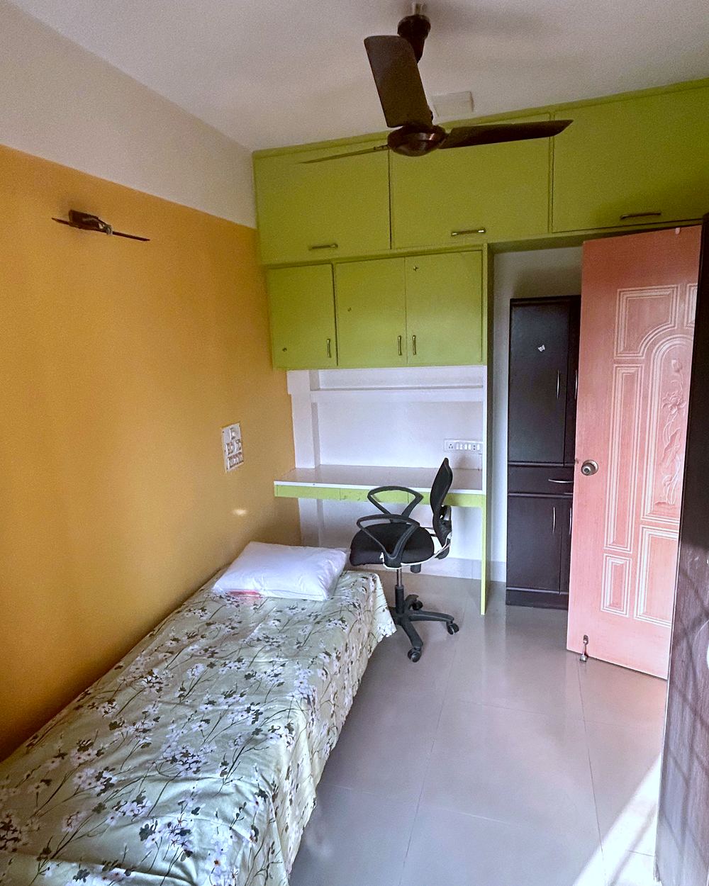 A private single room with its own bed, wardrobe, study chair and window